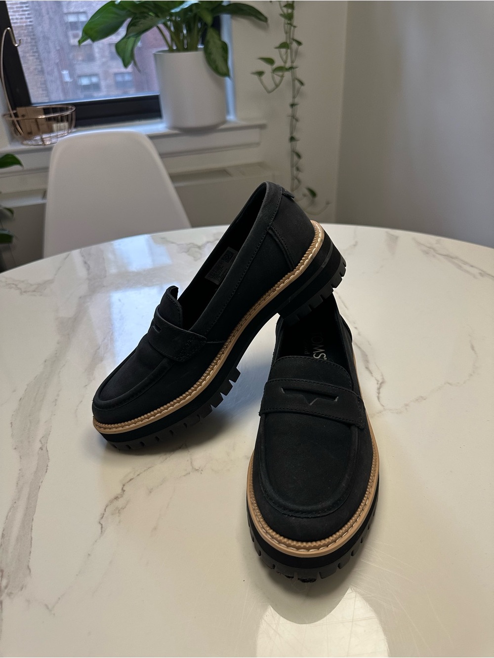 Toms Black Penny Loafers with Tan Trim